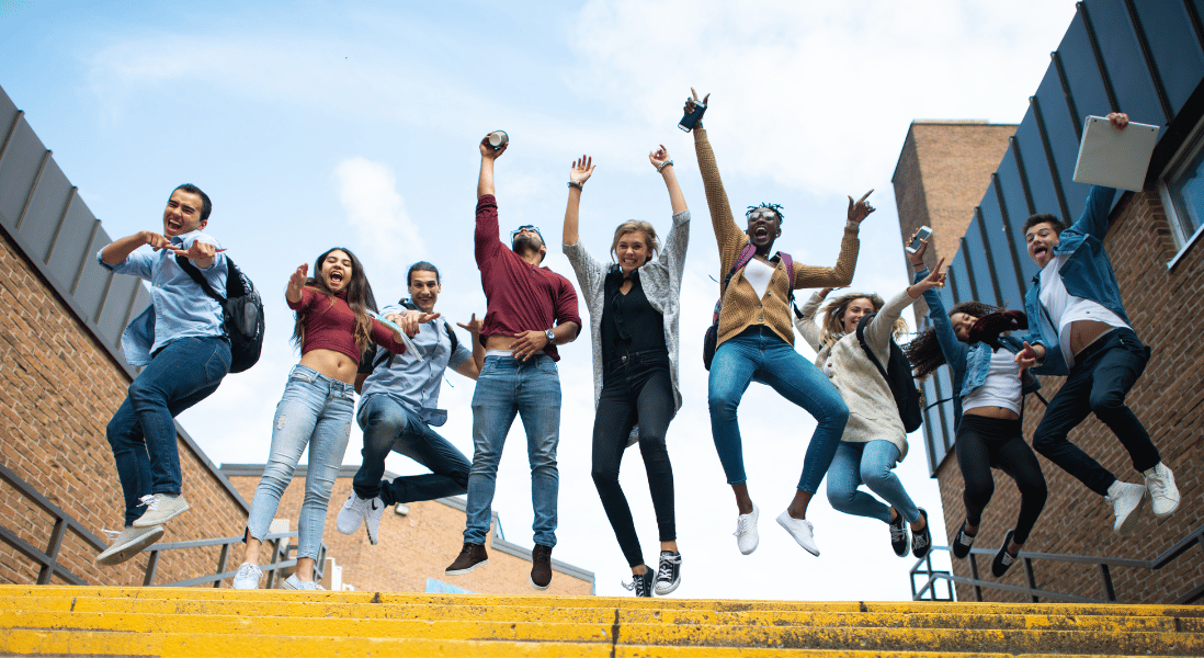 college students , excited  and jumping so high