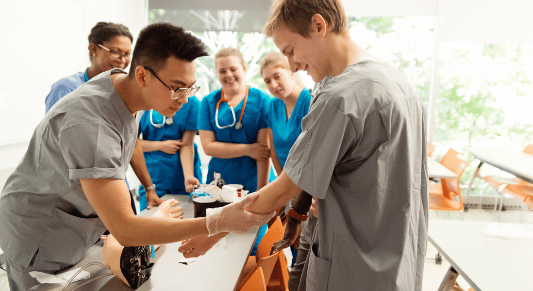 males and females nurses in the classroom doing practical demonstration 